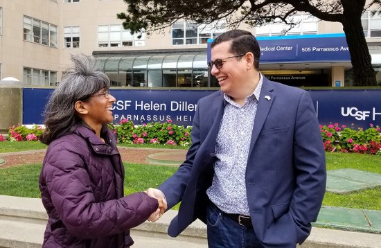 Dr. Anita Sil greets Assemblyman Rudy Salas. Sil is the co-director of the Microbial Pathogenesis and Host Defense Program at University of California, San Francisco.